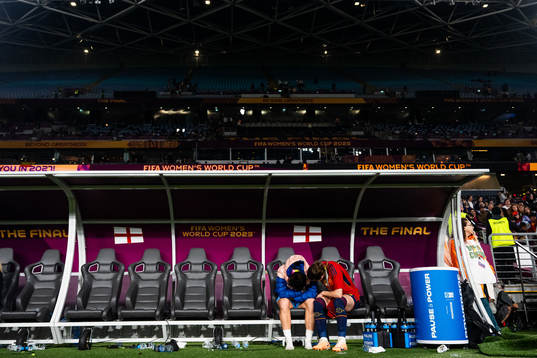 Lucy Bronze of England looks dejected and is consoled by