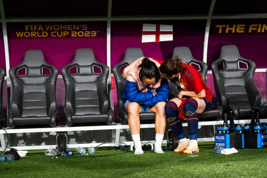 Lucy Bronze of England looks dejected and is consoled by