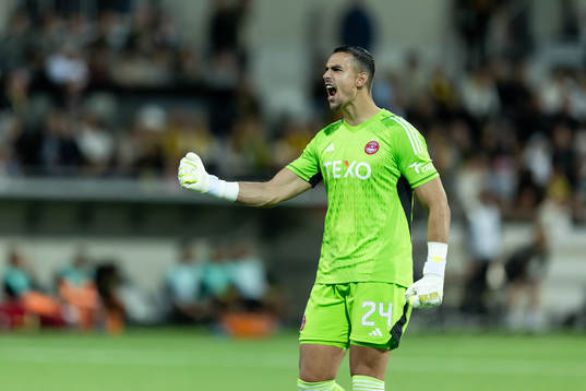 goalkeeper Kelle Roos of Aberdeen celebrates