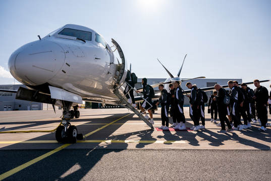 The Häcken team boards the airplane