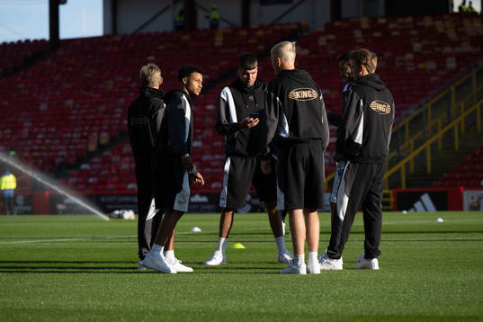 The players inspect the pitch