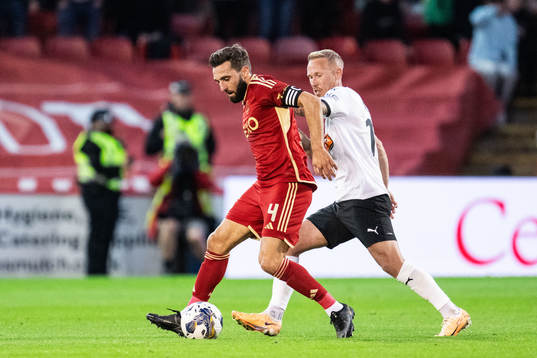 Graeme Shinnie of Aberdeen and Mikkel Rygaard Jensen of