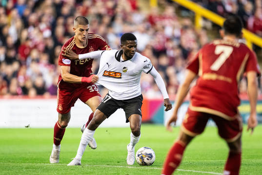 Slobodan Rubezic of Aberdeen and Akoua Romeo Amane  of
