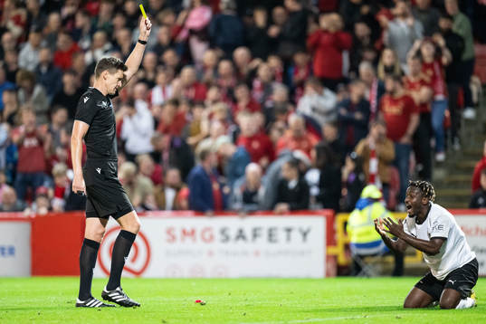 Ibrahim Sadiq  of Häcken reacts to receiving a yellow card
