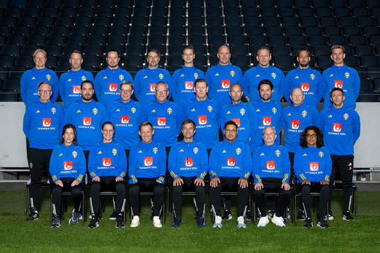 Staff of the Swedish national football team pose for a photo