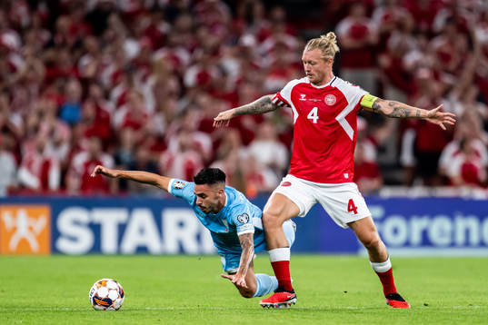 Fabio Tomassini of San Marino and Simon Kjær of Denmark