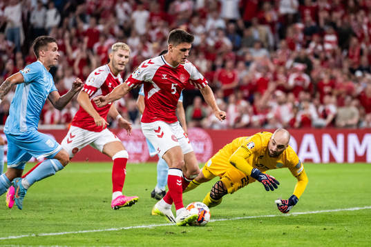 Joakim Mæhle of Denmark scores 2-0 behind goalkeeper Elia