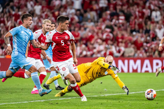 Joakim Mæhle of Denmark scores 2-0 behind goalkeeper Elia