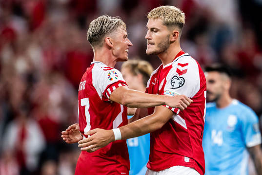 Jonas Wind of Denmark celebrates with Jens Stryger