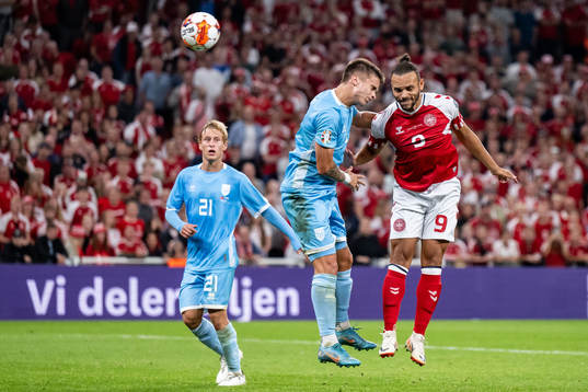 Alessandro Tosi of San Marino and Martin Braithwaite of