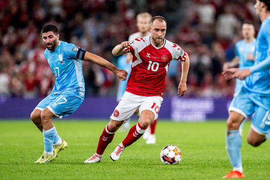 Alessandro Golinucci of San Marino and Christian Eriksen of
