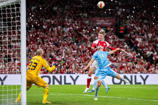Rasmus Højlund of Denmark against goalkeeper Elia