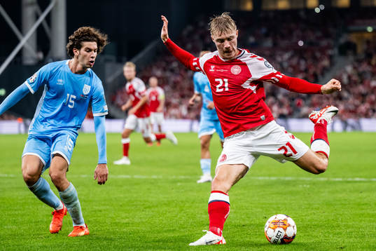 Simone Franciosi of San Marino and Rasmus Højlund of