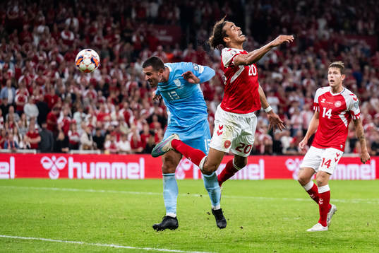 Yussuf Poulsen of Denmark scores 4-0 behind Roberto Di Maio
