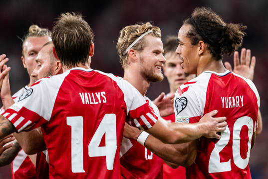 Yussuf Poulsen of Denmark celebrates with team mates