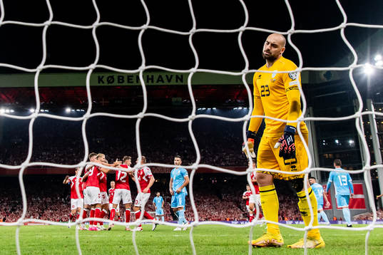 Goalkeeper Elia Benedettini of San Marino looks dejected