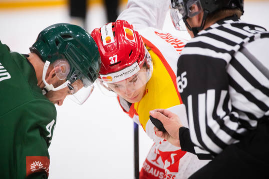 Henrik Björklund of Färjestad and Mattheo Reinhard of EHC