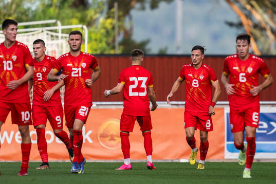 Ivan Nikolov of North Macedonia celebrate with teammates