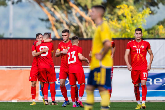 Ivan Nikolov of North Macedonia celebrates with team mates