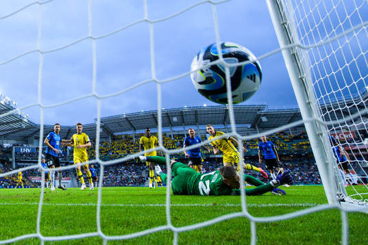 Dejan Kulusevski of Sweden scores 0-2 behind goalkeeper