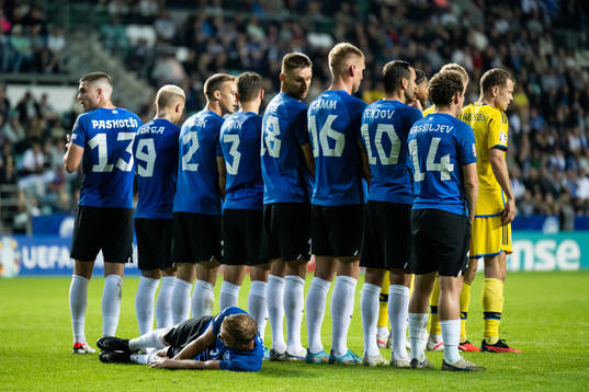 Players of Estonia form a wall