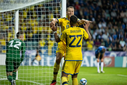 Viktor Claesson and Robin Quaison of Sweden celebrate