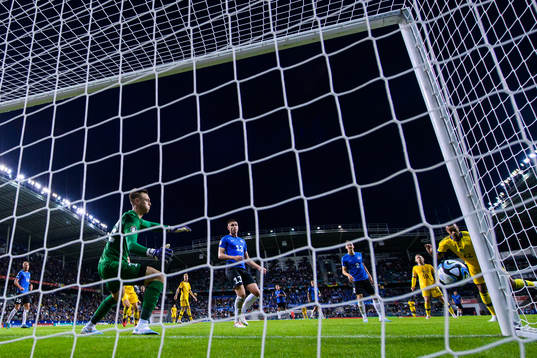 Robin Quaison of Sweden scores 0-4 behind goalkeeper Karl