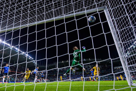 Viktor Claesson of Sweden scores 0-5 behind goalkeeper Karl