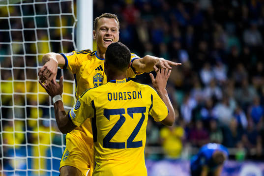 Viktor Claesson and Robin Quaison of Sweden celebrate the