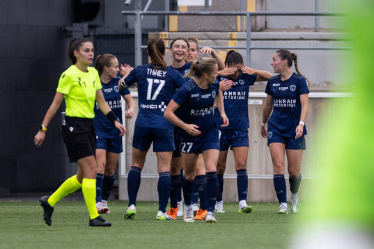 Mathilde Bourdieu of Paris FC celebrate with teammates