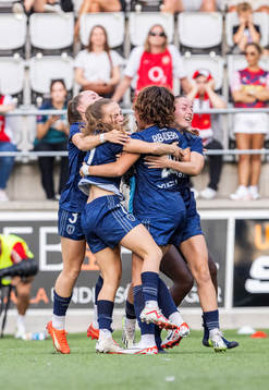 Players of Paris FC celebrate