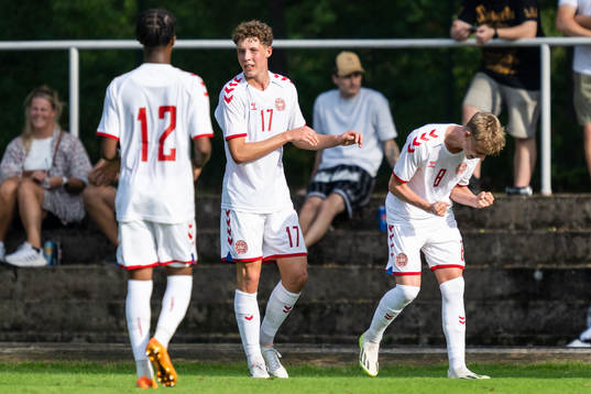 Tobias Lund of Denmark celebrate with teammates