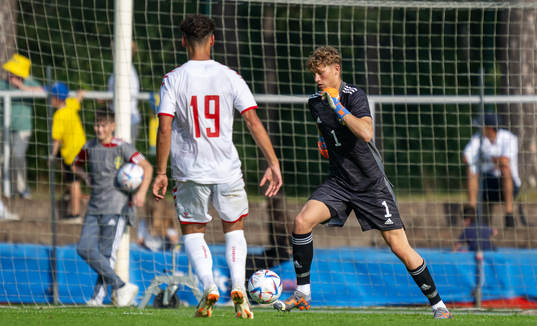 Amin Chiakha of Denmark and goalkeeper William Nieroth
