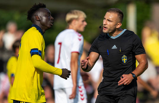 Kalipha Jawla of Sweden and Referee Fidan Hasani