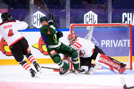 Michael Lindqvist of Färjestad and goaltender Albert