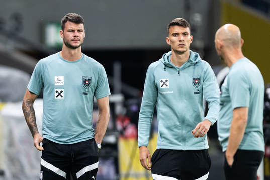 Goalkeeper Daniel Bachmann and Dejan Ljubicic of the