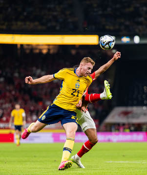 Dejan Kulusevski of Sweden and Phillipp Mwene of Austria