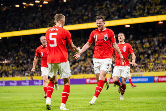 Michael Gregoritsch and Stefan Posch of Austria celebrate