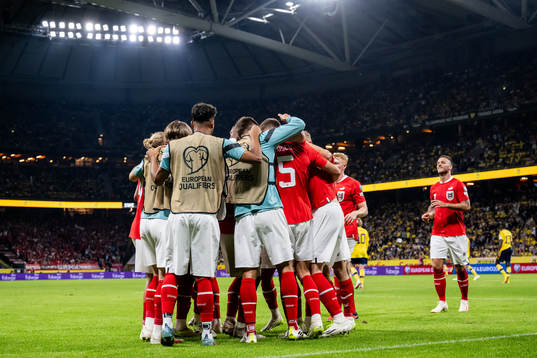 Michael Gregoritsch of Austria celebrates with teammates