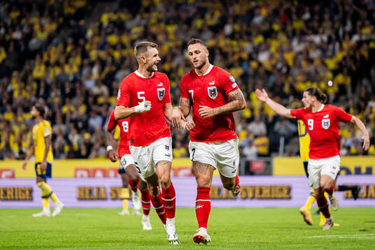 Stefan Posch and Marko Arnautovic of Austria celebrate