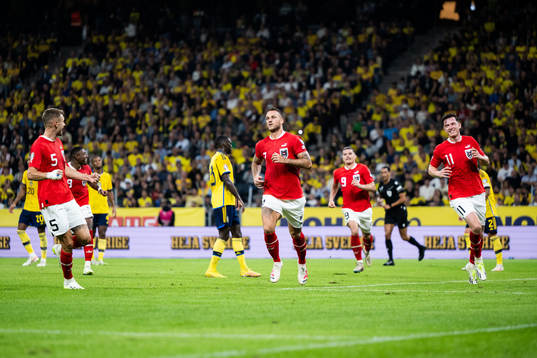 Marko Arnautovic of Austria celebrates with Stefan Posch,