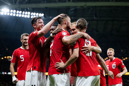 Marko Arnautovic of Austria celebrates with team mates