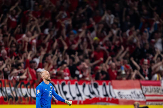 Goalkeeper Alexander Schlager of Austria celebrates