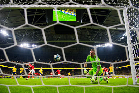 Goalkeeper Robin Olsen of Sweden looks dejected when Marko
