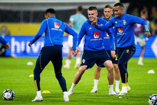 Emil Holm and Robin Quaison of Sweden