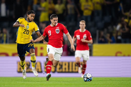 Jens-Lys Michel Cajuste of Sweden and Marcel Sabitzer of