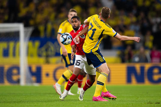 Philip Mwene of Austria and Dejan Kulusevski of Sweden
