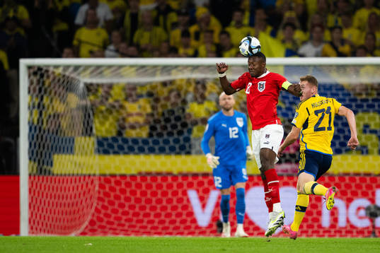 David Alaba of Austria and Dejan Kulusevski of Sweden