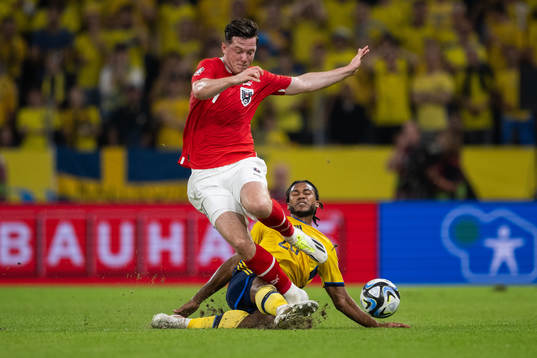 Michael Gregoritsch of Austria and Jens-Lys Michel Cajuste