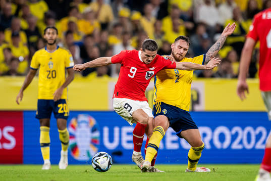 Marcel Sabitzer of Austria and Linus Wahlqvist Egnell of